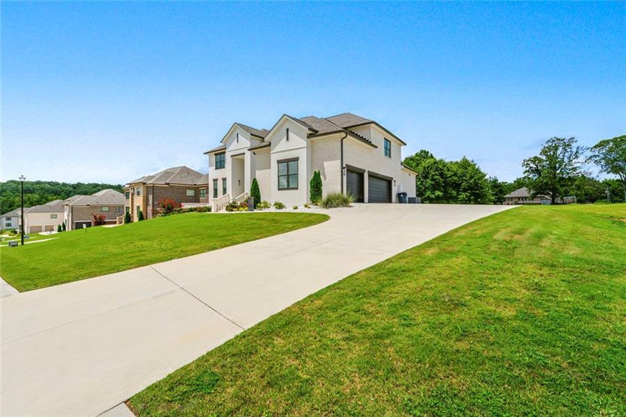 Front exterior of a new home in , Conyers, GA, highlighting curb appeal (Image 25).