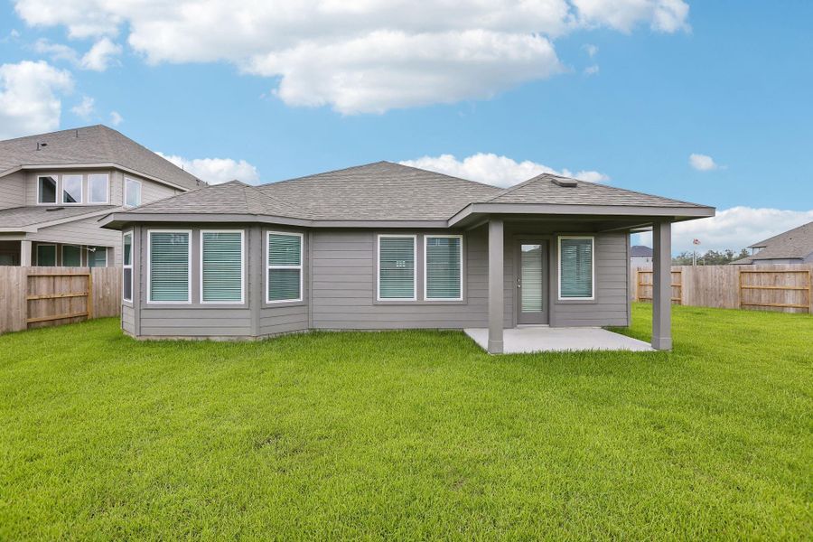 Exterior details and patio area of a home in Riviera Pines - Classic Series, Huffman (Image 3).