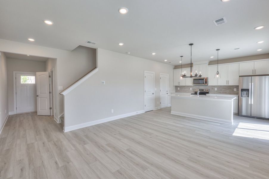 Enter the open-concept floorplan home, where the kitchen overlooks the living room. Enter the open-concept floorplan home, where the kitchen overlooks the living room.