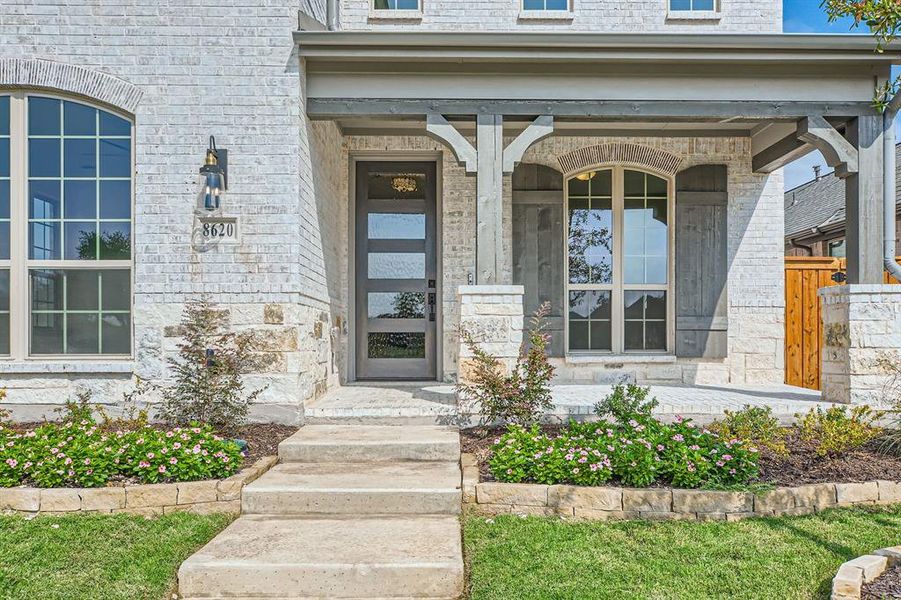 Property entrance featuring covered porch