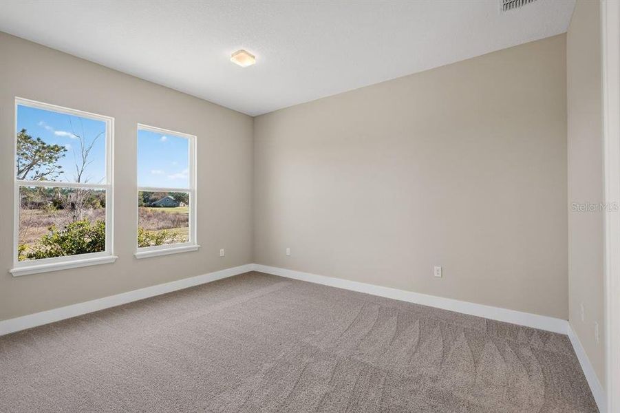 Spacious, unfurnished interior of a new home in Gray Hawk at Hole Two, Daytona Beach (Image 40).