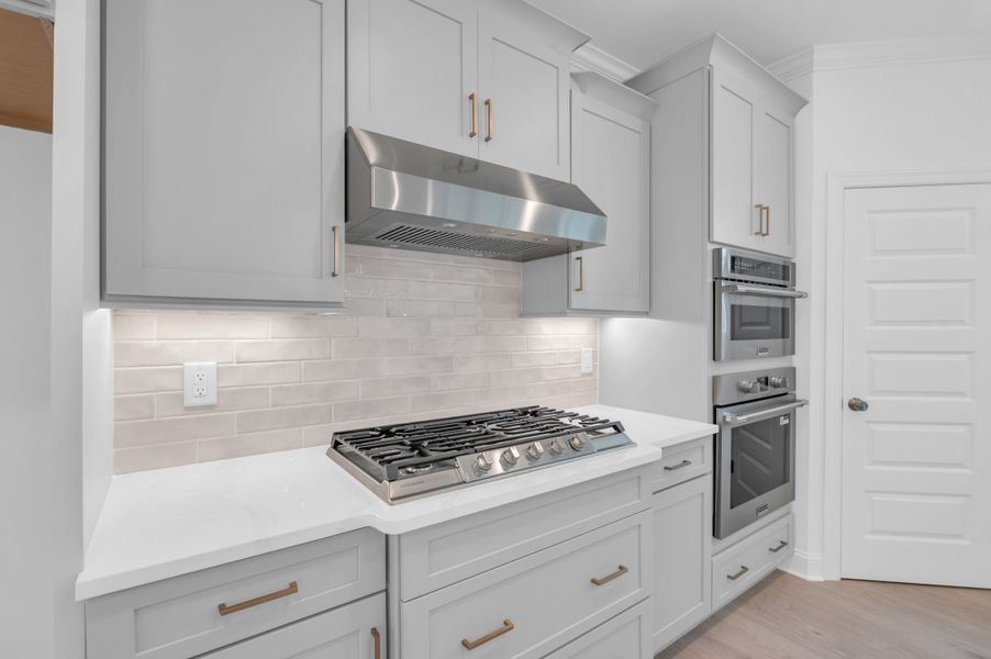 Representative furnished interior of a home built from the The Highland by RobuckHomes in Windwater, Hampstead (Image 12).