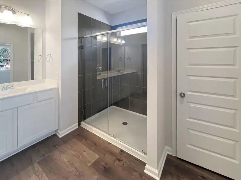 The Oriole II- Primary Bathroom with Large Walk-in Shower. Home under construction, photo used for illustrative purposes only, colors and options will vary.