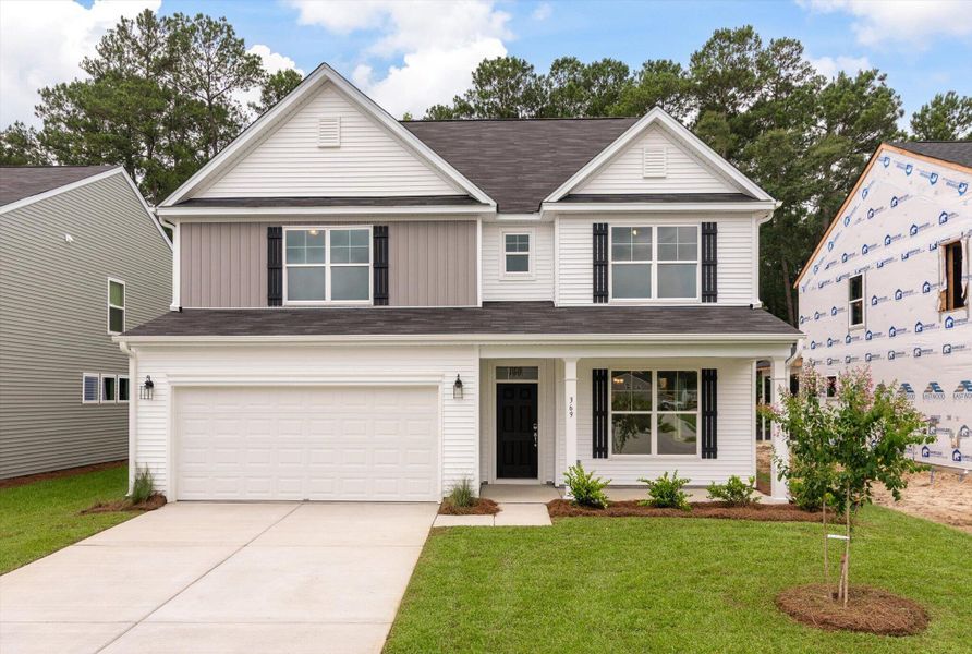 Front exterior of a new home in Oakley Pointe, Moncks Corner, SC, highlighting curb appeal (Image 23). Front exterior of a new home in Oakley Pointe, Moncks Corner, SC, highlighting curb appeal (Image 23).
