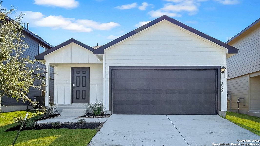 Front exterior of a new home in Redbird Ranch, San Antonio, TX, highlighting curb appeal (Image 1). Front exterior of a new home in Redbird Ranch, San Antonio, TX, highlighting curb appeal (Image 1).