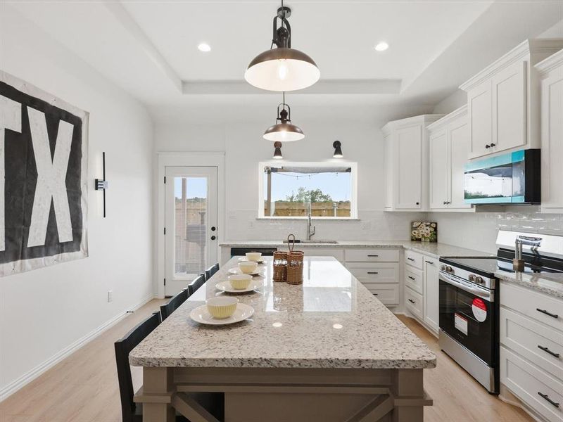 This kitchen is ready to host your gatherings with plenty of space on the beautiful island.