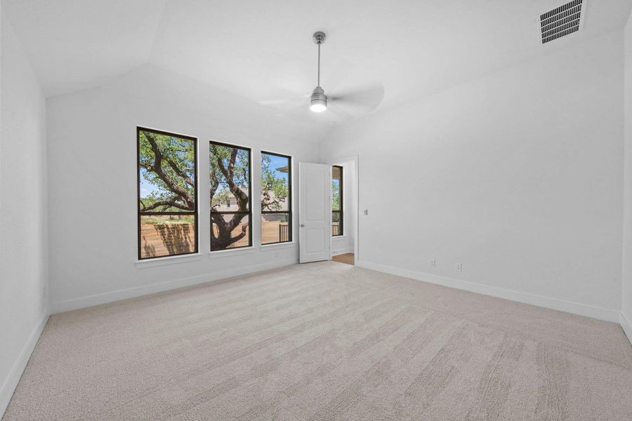 Primary Bedroom with elevated ceiling Primary Bedroom with elevated ceiling