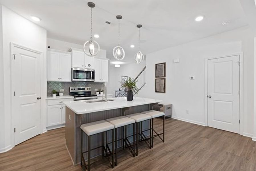 Representative furnished interior of a home built from the Alexandria TH by True Homes in Covington Ridge Townhomes, Thomasville (Image 4).