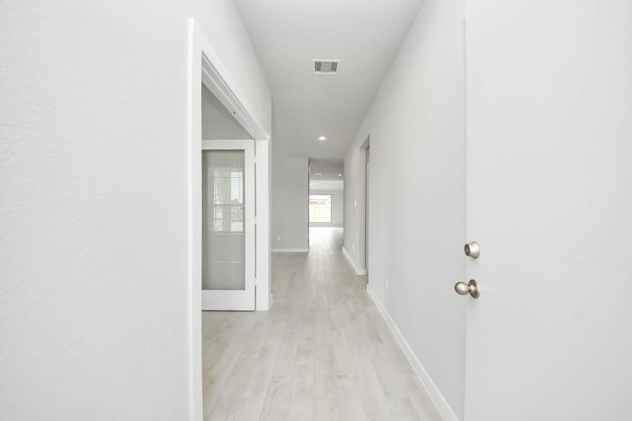 As you step into the threshold of this luxurious home, you'll soon be welcomed by an elegant glass door (to be installed). Inside, soaring ceilings amplify the spaciousness, while the refined wood-look tile flooring and oversized baseboards exude sophistication and charm. As you step into the threshold of this luxurious home, you'll soon be welcomed by an elegant glass door (to be installed). Inside, soaring ceilings amplify the spaciousness, while the refined wood-look tile flooring and oversized baseboards exude sophistication and charm.