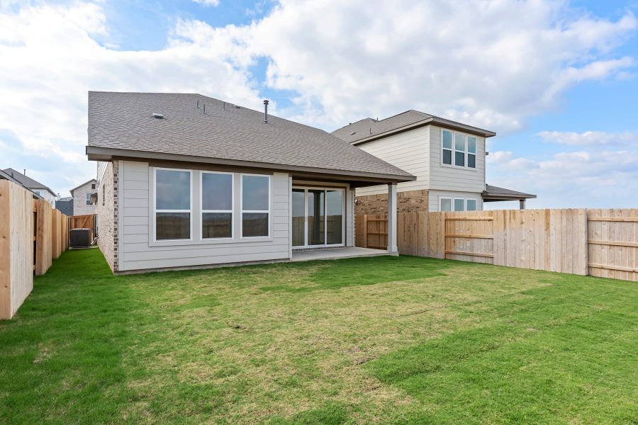 Exterior details and patio area of a home in Lariat, Liberty Hill (Image 26).