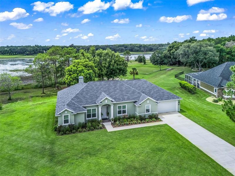 Front exterior of a new home in , Lady Lake, FL, highlighting curb appeal (Image 1). Front exterior of a new home in , Lady Lake, FL, highlighting curb appeal (Image 1).