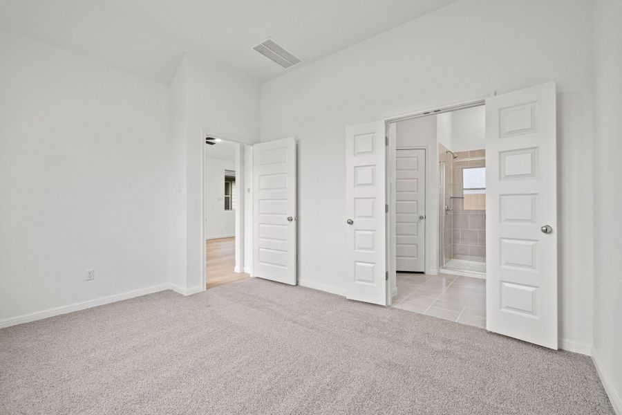 Primary Suite in the Birch home plan by Trophy Signature Homes – REPRESENTATIVE PHOTO
