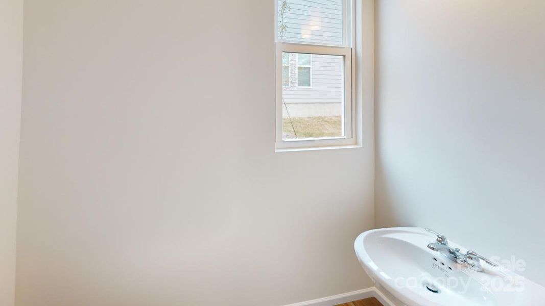 Photo is representation - Half bath located on main level