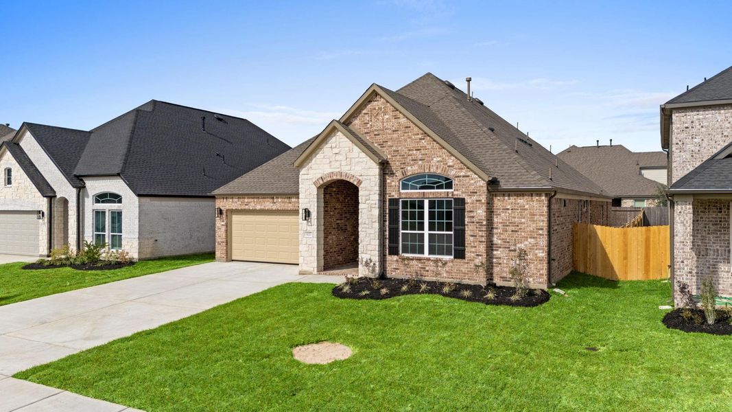 Front exterior of a new home in Barton Creek Ranch, Conroe, TX, highlighting curb appeal (Image 2). Front exterior of a new home in Barton Creek Ranch, Conroe, TX, highlighting curb appeal (Image 2).