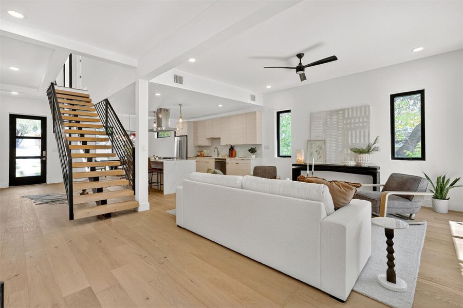 The living room invites you to linger, with soaring ceilings, sunlit windows, and a sense of effortless flow that makes it perfect for both quiet mornings and lively gatherings The living room invites you to linger, with soaring ceilings, sunlit windows, and a sense of effortless flow that makes it perfect for both quiet mornings and lively gatherings