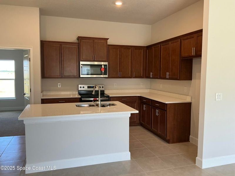 Furnished interior view inside a new home in St. John Preserve, Palm Bay (Image 4).