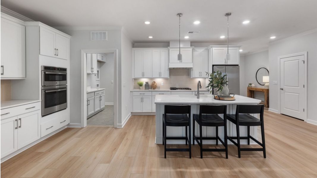 Furnished interior view inside a new home in The Courtyards at Oak Grove, Durham (Image 8).