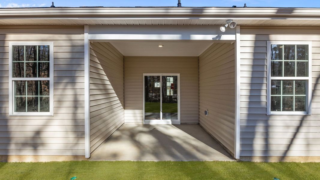 Exterior details and patio area of a home in Tyler - Home on the Lake, New Bern (Image 22).