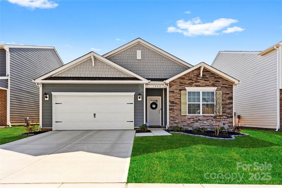 Front exterior of a new home in Secrest Commons, Monroe, NC, highlighting curb appeal (Image 18).