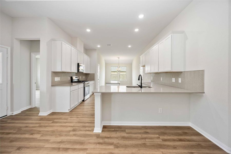 Enjoy the upgraded kitchen with beautiful herringbone backsplash for the perfect touch of elegance. Enjoy the upgraded kitchen with beautiful herringbone backsplash for the perfect touch of elegance.