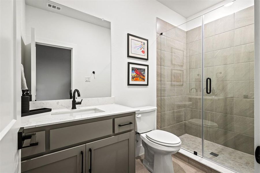 Bathroom featuring vanity and a stall shower Bathroom featuring vanity and a stall shower