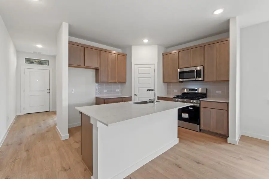 Kitchen in the Pearl home plan by Trophy Signature Homes – REPRESENTATIVE PHOTO Kitchen in the Pearl home plan by Trophy Signature Homes – REPRESENTATIVE PHOTO