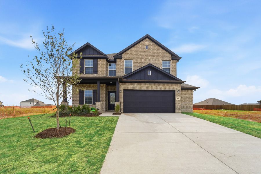 Front exterior of a new home in Saddlebrook Estates, Waxahachie, TX, highlighting curb appeal (Image 1). Front exterior of a new home in Saddlebrook Estates, Waxahachie, TX, highlighting curb appeal (Image 1).