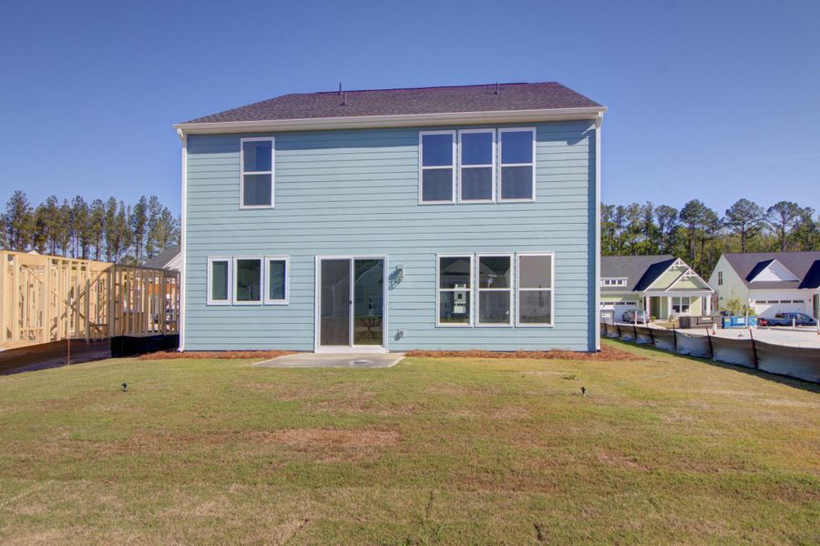 Exterior details and patio area of a home in Homecoming, Ravenel (Image 24). Exterior details and patio area of a home in Homecoming, Ravenel (Image 24).