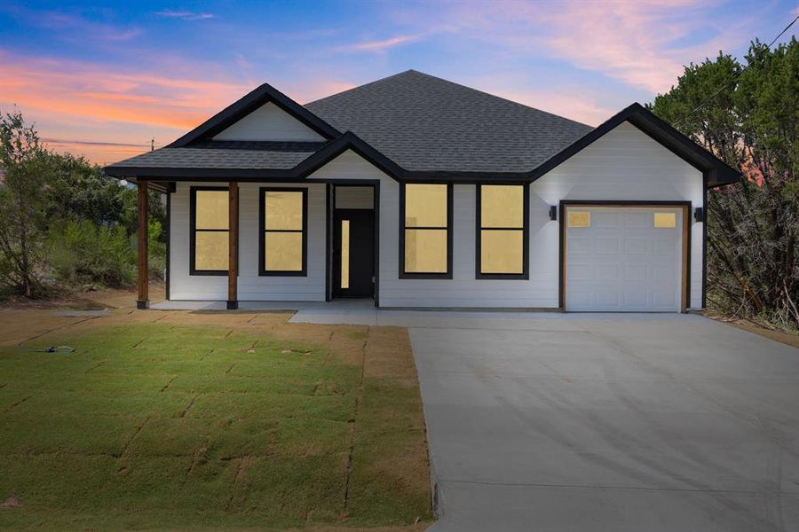 Front exterior of a new home in , Granbury, TX, highlighting curb appeal (Image 18). Front exterior of a new home in , Granbury, TX, highlighting curb appeal (Image 18).