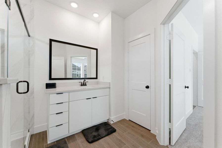 Dual-sink vanity with modern cabinetry and sleek finishes offers both style and everyday functionality.
