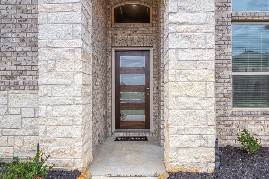 Representative exterior details of a home built from the Floor Plan 2050 by Colina Homes in Grand Magnolia, Magnolia (Image 4).