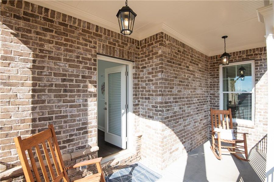 Exterior details and patio area of a home in The Estates at Hurricane Pointe, Douglasville (Image 4).