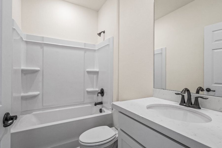 Furnished interior view inside a new home in Natureview, Freeport (Image 9).