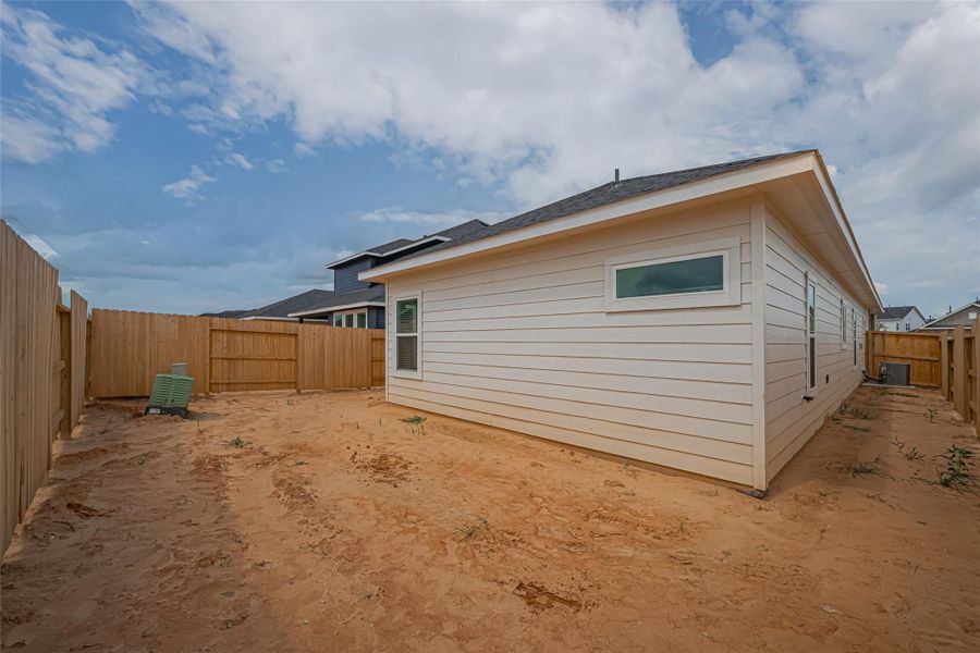 Exterior details and patio area of a home in La Segarra, Brookshire (Image 24).
