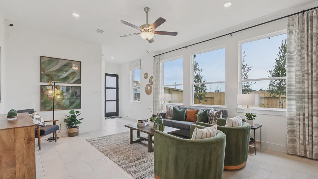 Representative furnished interior of a home built from the Adele by Chesmar Homes in Sunterra, Katy (Image 6).
