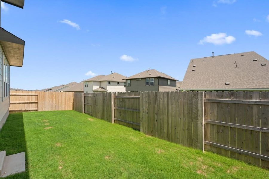 Exterior details and patio area of a home in Lariat, Liberty Hill (Image 3).