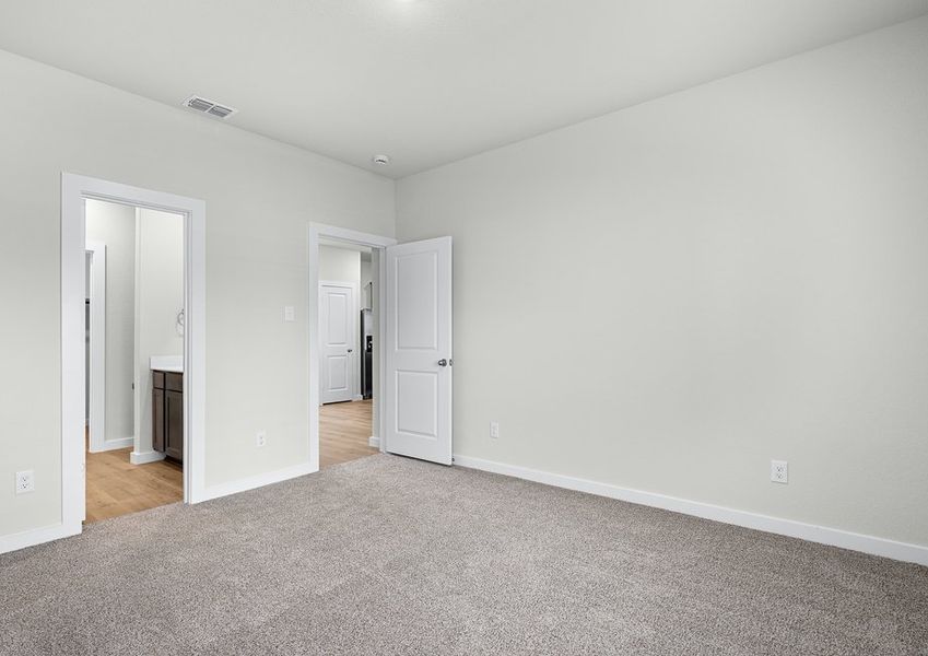 The master suite has a large bedroom, ensuite bathroom and a walk-in closet.
