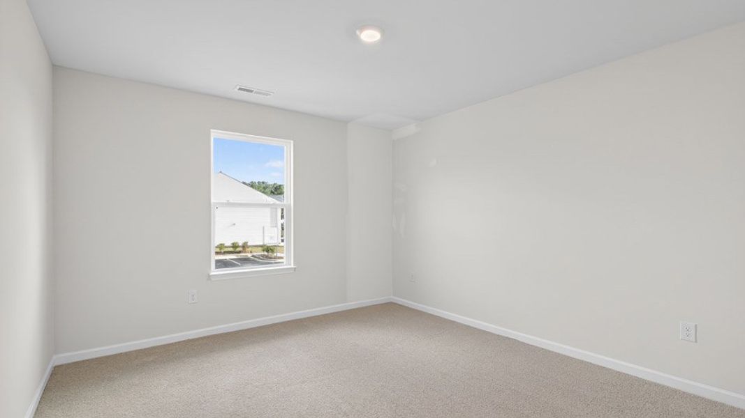 Spacious, unfurnished interior of a new home in The Townes at Honeycutt Oaks, Angier (Image 26).