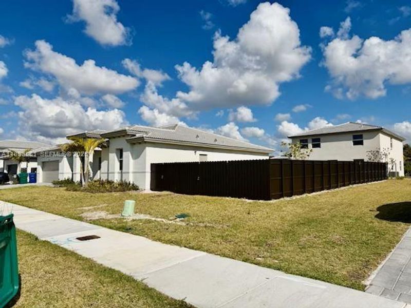 Exterior details and patio area of a home in Hawthorne at Galiano Pointe, Miami (Image 3).