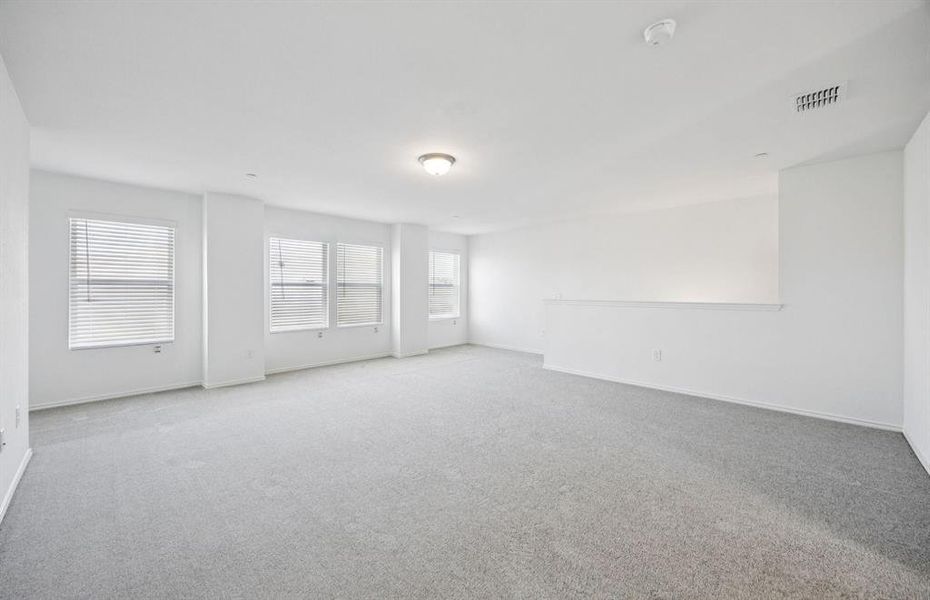 Spacious game room with large windows