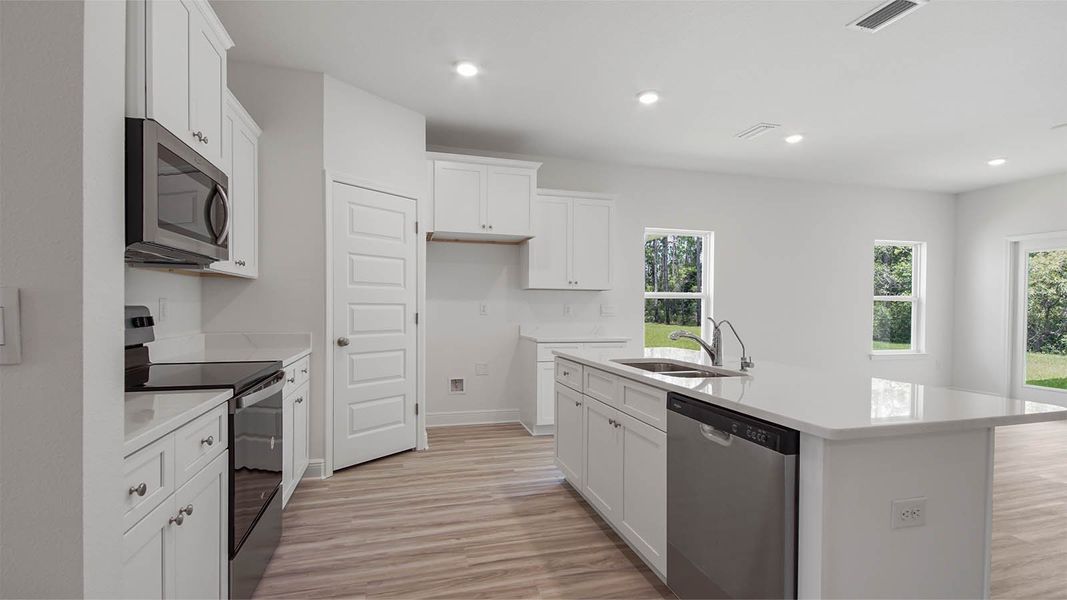 Representative furnished interior of a home built from the Kennedy by D.R. Horton in Bayside at Ward Creek, Panama City Beach (Image 5).