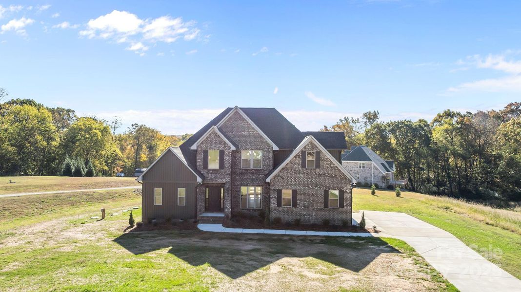 Front exterior of a new home in , Monroe, NC, highlighting curb appeal (Image 1).