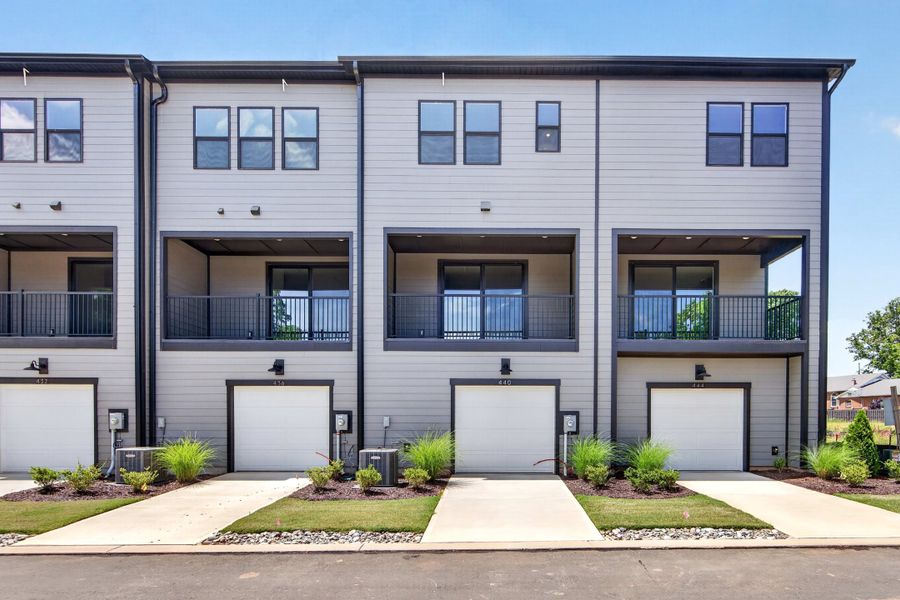 Front exterior of a new home in Old Town Village, Waxhaw, NC, highlighting curb appeal (Image 1). Front exterior of a new home in Old Town Village, Waxhaw, NC, highlighting curb appeal (Image 1).