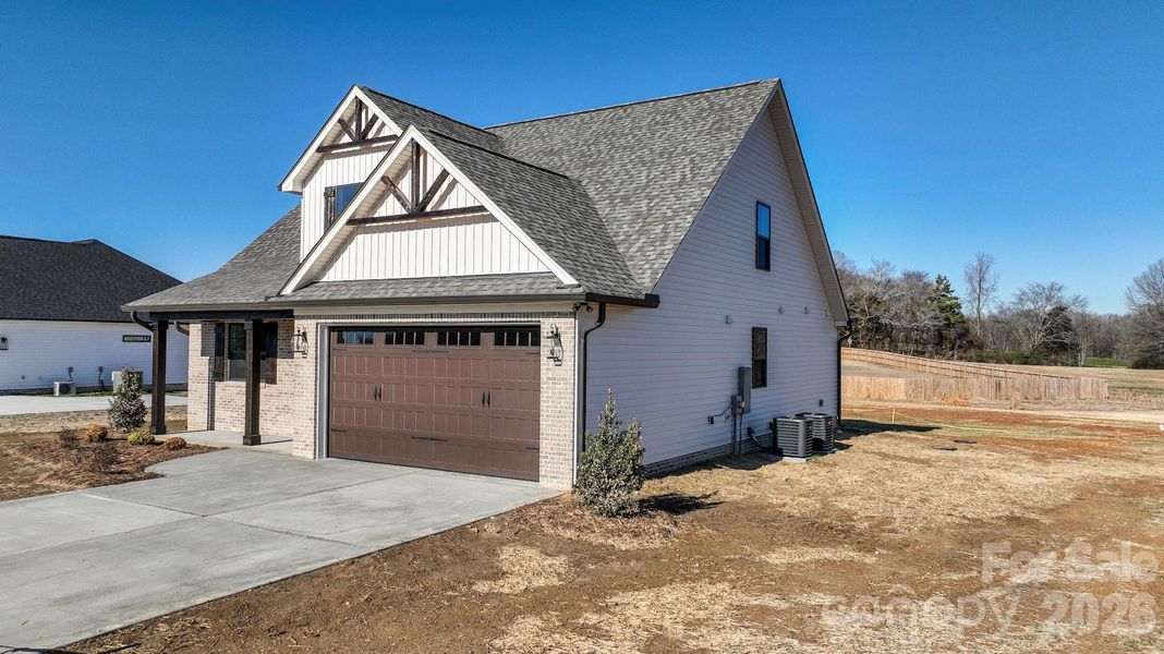 Front exterior of a new home in , Wingate, NC, highlighting curb appeal (Image 20).