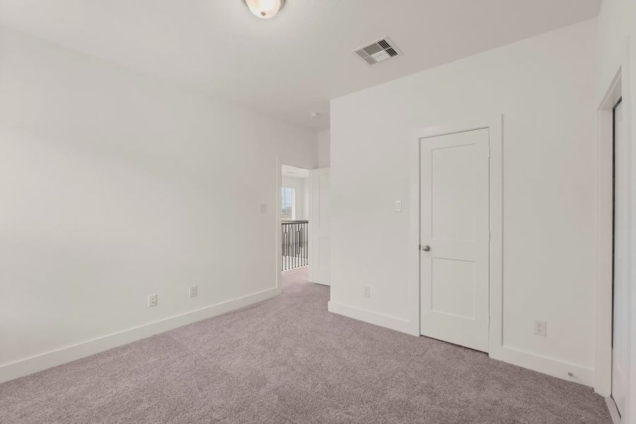Representative unfurnished interior of a home built from the St Andrews by Chesmar Homes in Riceland Alley Loads, Mont Belvieu (Image 65).