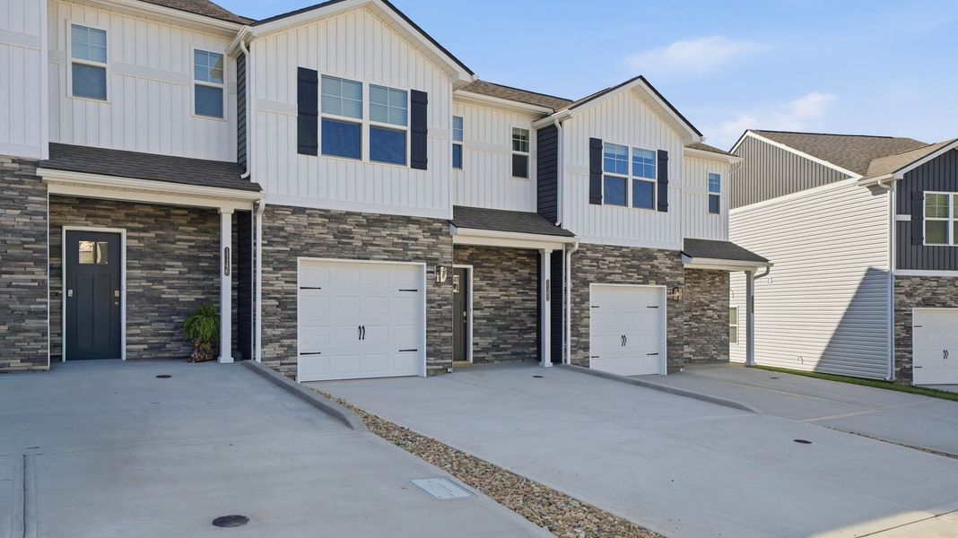 Front exterior of a new home in The Arbor Townhomes, Kingsport, TN, highlighting curb appeal (Image 1). Front exterior of a new home in The Arbor Townhomes, Kingsport, TN, highlighting curb appeal (Image 1).