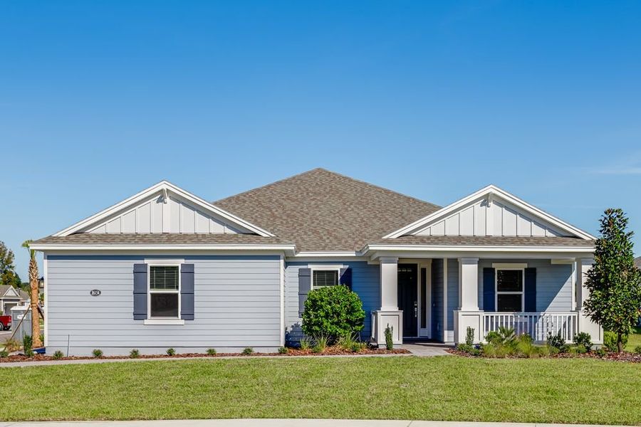 Front exterior of a new home in Headwaters at Lofton Creek, Yulee, FL, highlighting curb appeal (Image 1). Front exterior of a new home in Headwaters at Lofton Creek, Yulee, FL, highlighting curb appeal (Image 1).