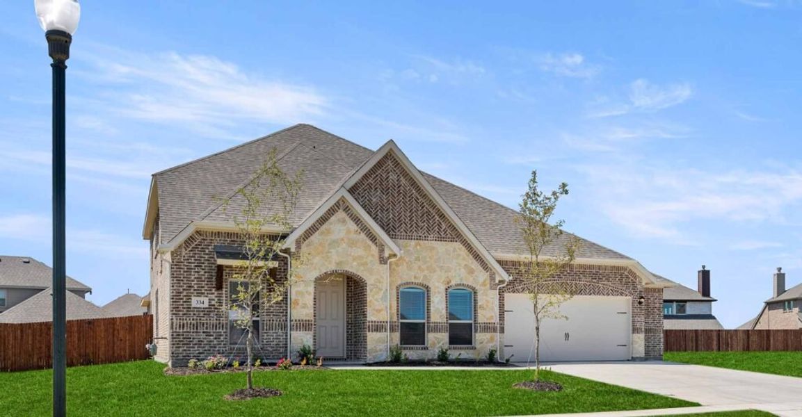 Representative exterior photo of a completed home built from the Goodrich by Impression Homes in Timberbrook, Justin, TX (Image 2).