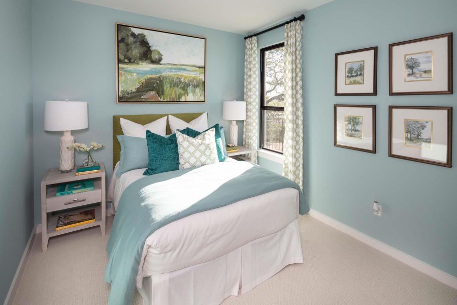 Bedroom featuring carpet flooring and baseboards