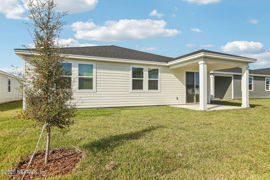 Exterior details and patio area of a home in Cypress Meadows - Signature Series, Jacksonville (Image 3).